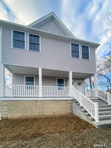 a front view of a house with a swimming pool