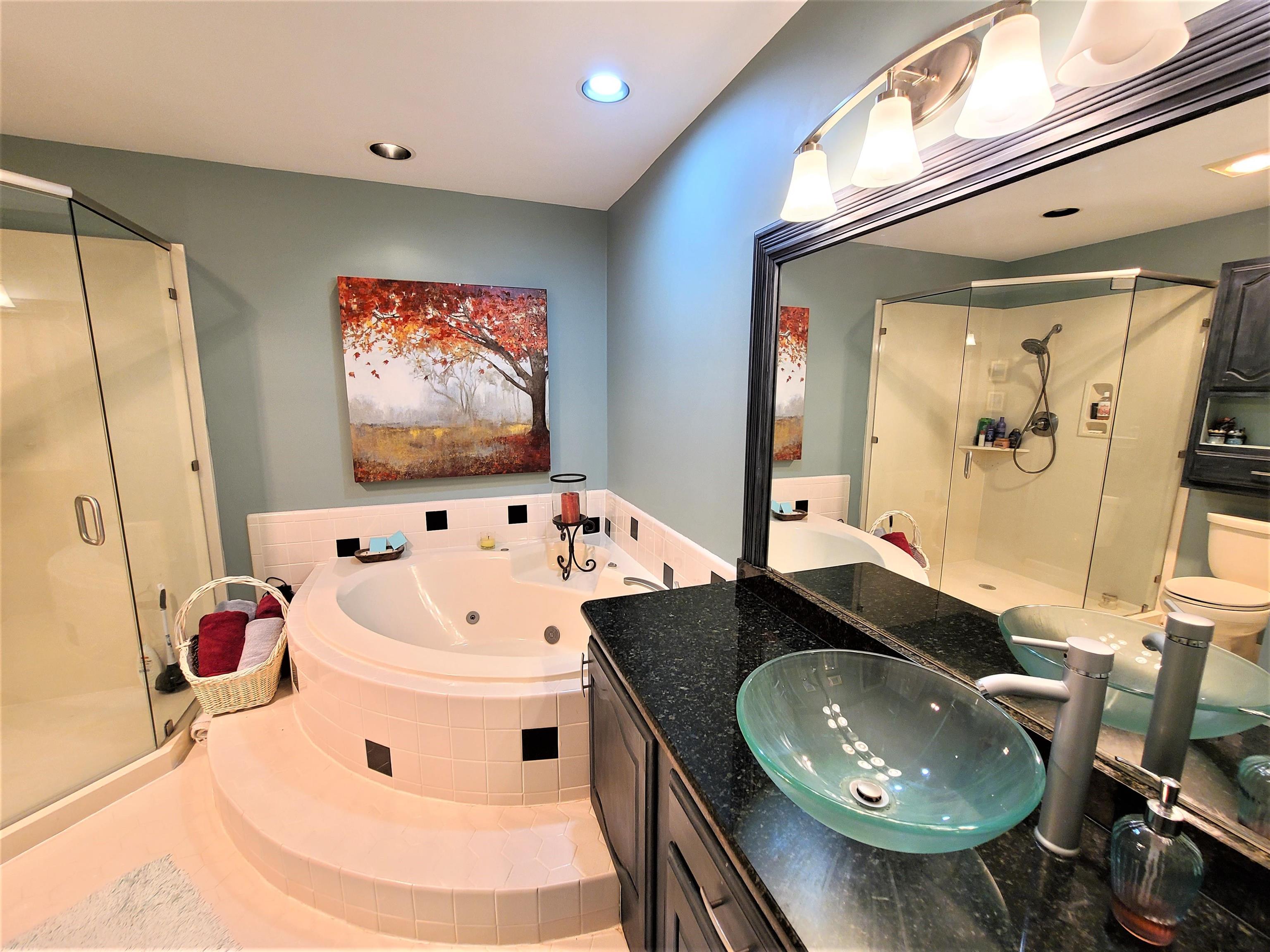 90 Riviera Cove Cherokee, AL 35616 - Photo 12 of 21 a bathroom with a sink and mirror with bathtub