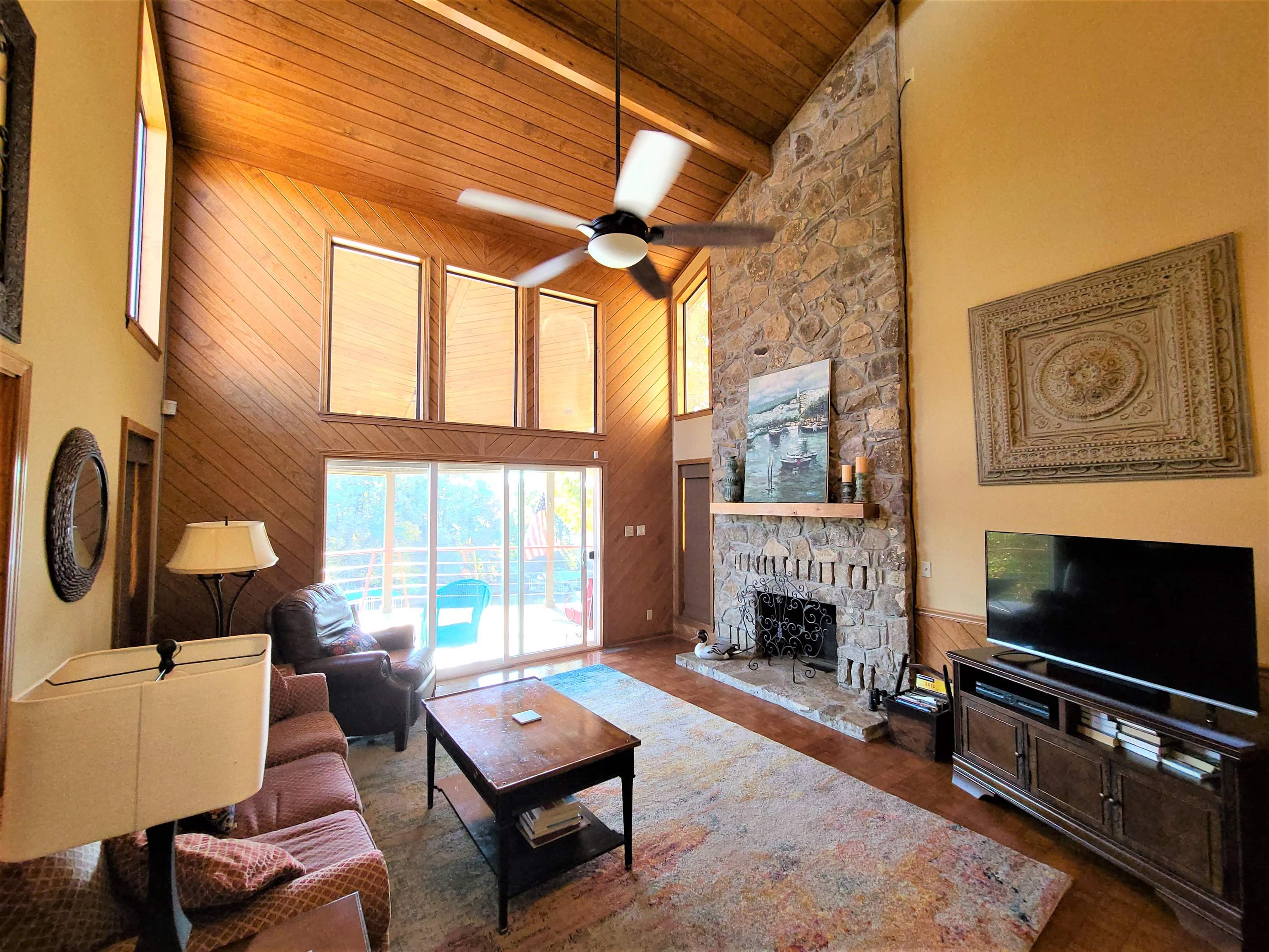90 Riviera Cove Cherokee, AL 35616 - Photo 7 of 21 a living room with furniture a fireplace with outer view