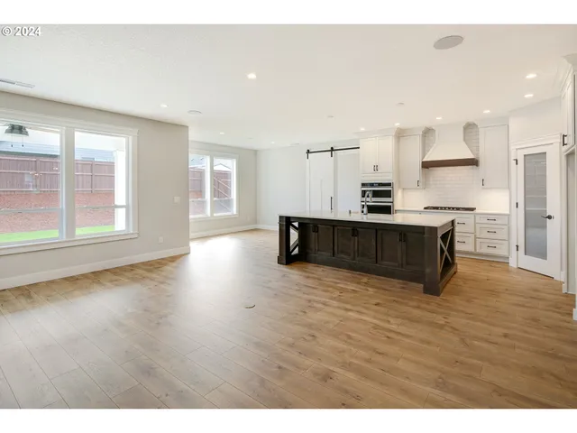 a view of kitchen with wooden floor