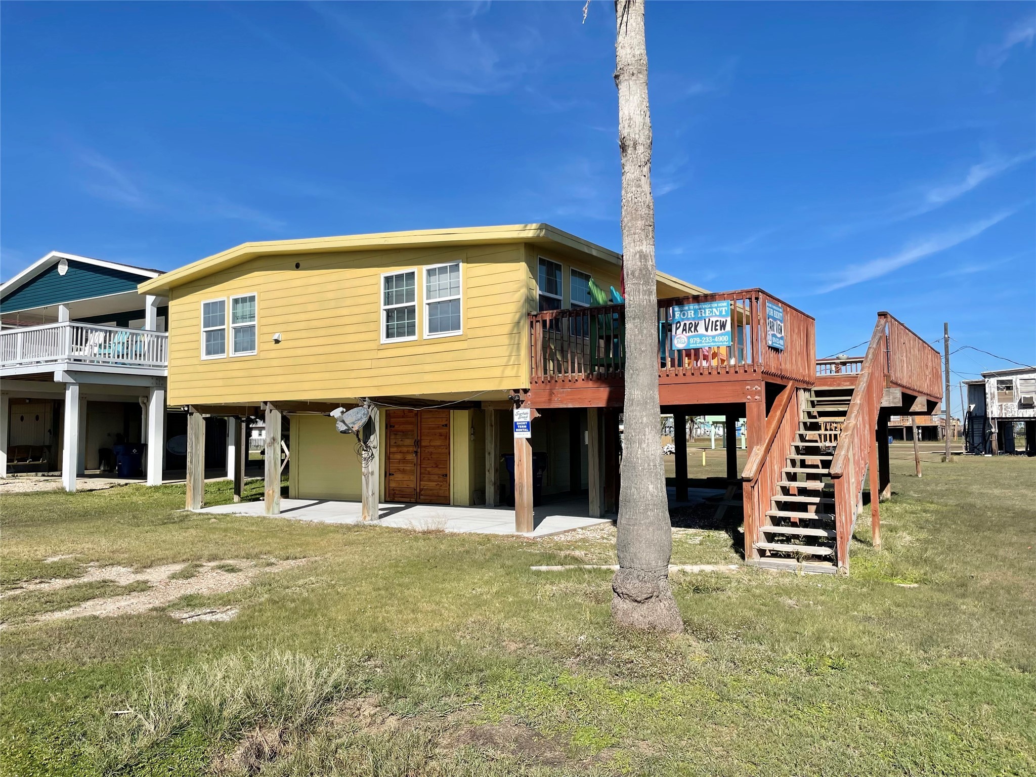 308 Parkview Road Surfside Beach, TX 77541 - Photo 1 of 18 a front view of a building with a garden