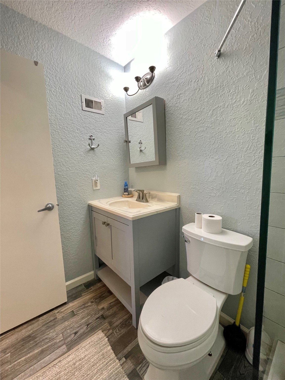 308 Parkview Road Surfside Beach, TX 77541 - Photo 14 of 18 a bathroom with a sink mirror and toilet