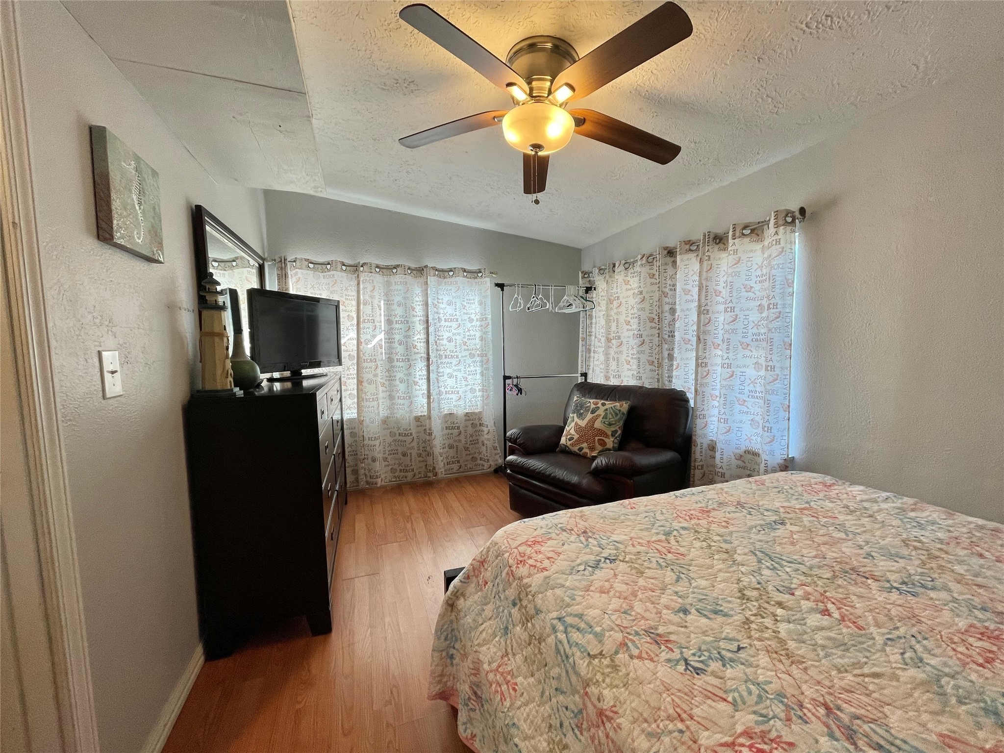 308 Parkview Road Surfside Beach, TX 77541 - Photo 18 of 18 a bedroom with a bed and a flat screen tv
