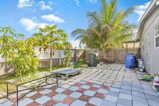 a chair and table sitting in front of a building