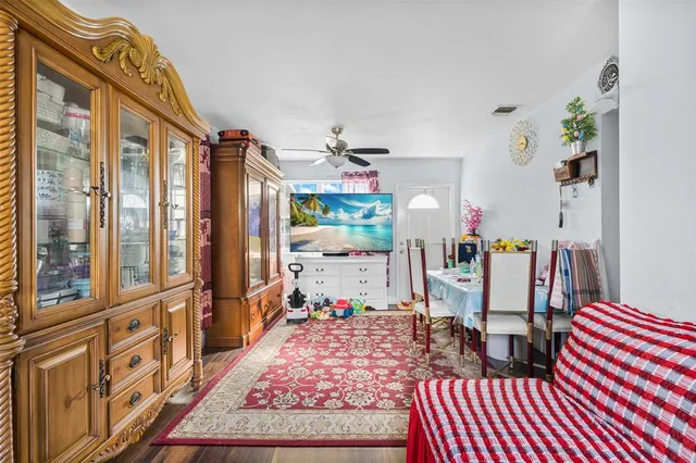 a living room with lots of furniture and a rug