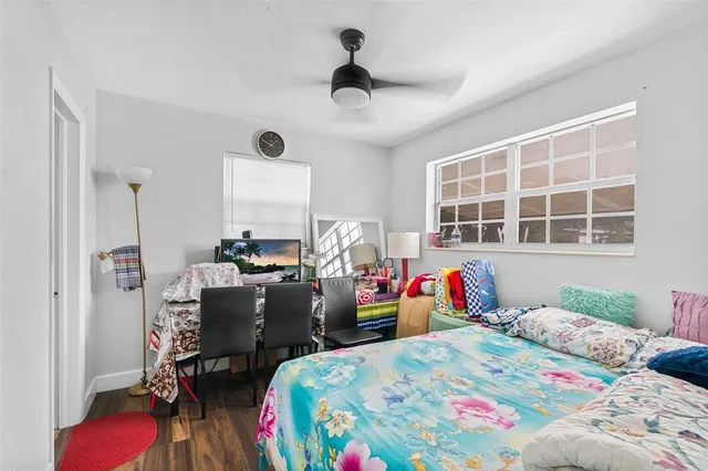 a bed room with a bed and a chair