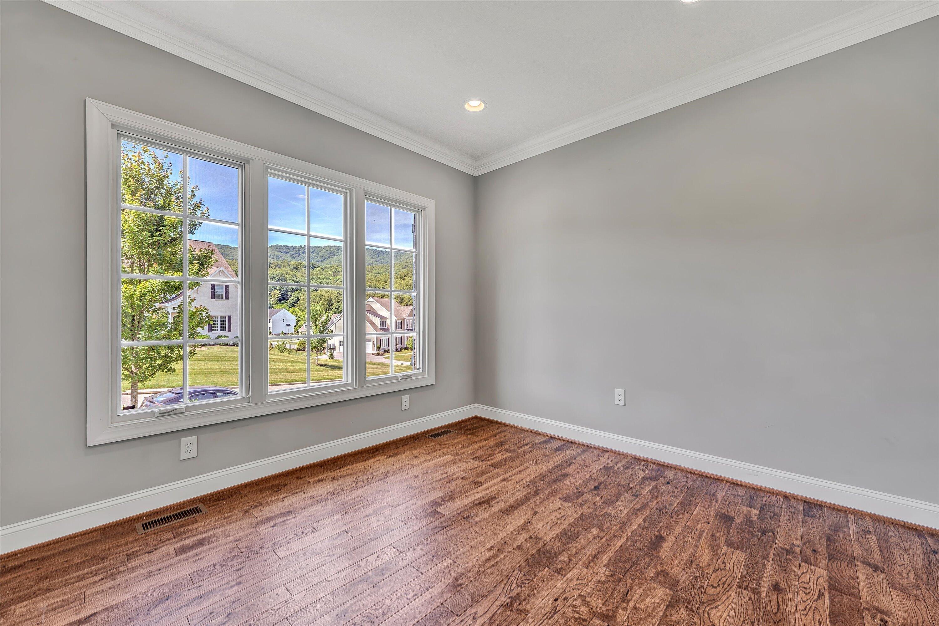 6981 Fairway Ridge Road Salem, VA 24153 - Photo 12 of 53 a view of an empty room with wooden floor and a window
