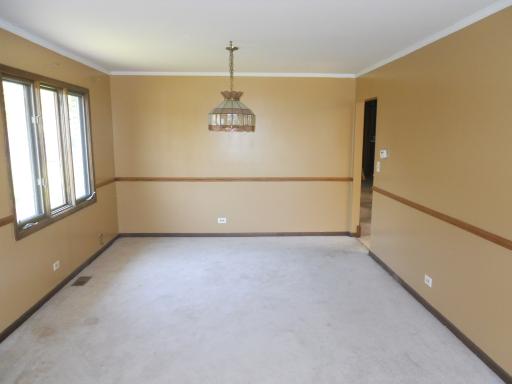 3512 Ronald Road Crete, IL 60417 - Photo 5 of 14 a view of an empty room with a window