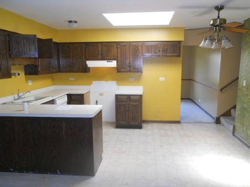 3512 Ronald Road Crete, IL 60417 - Photo 6 of 14 a kitchen with a sink cabinets and appliances