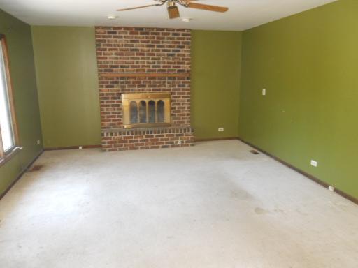 3512 Ronald Road Crete, IL 60417 - Photo 7 of 14 a view of an empty room with brick wall and a window