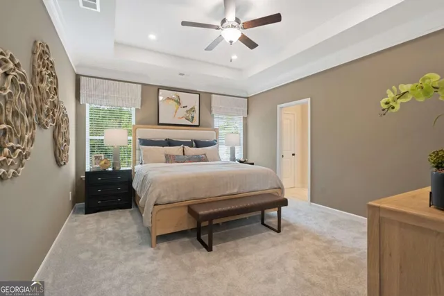 a bedroom with a bed dresser and a window