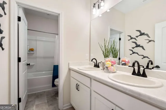 a bathroom with a sink a vanity and a mirror