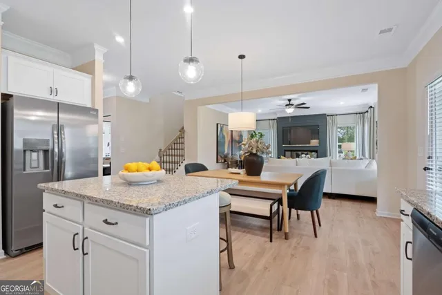 a kitchen with a sink a counter space and stainless steel appliances