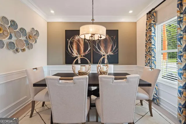 a dining room with furniture and wooden floor