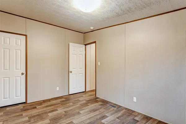 a bedroom with a bed couch and window