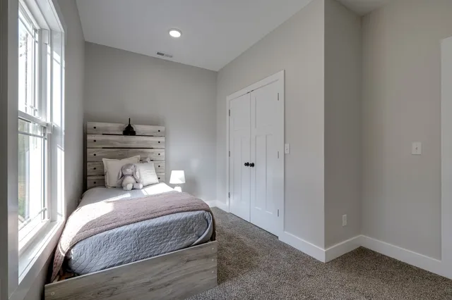 a view of staircase with black white walls