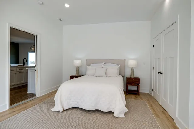 a bedroom with a bed and a chair