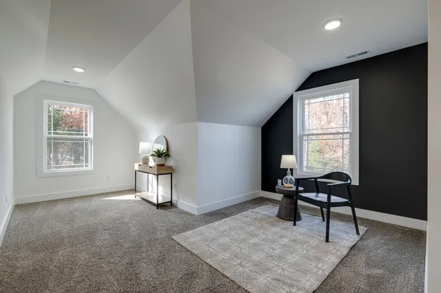 a bathroom with a bathtub shower sink and toilet
