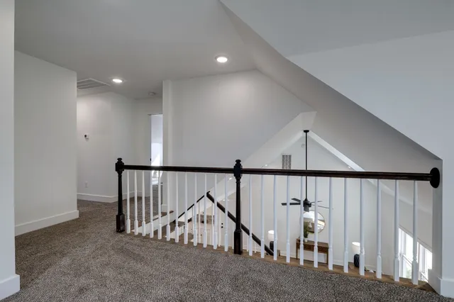 a bedroom with a bed and a mirror