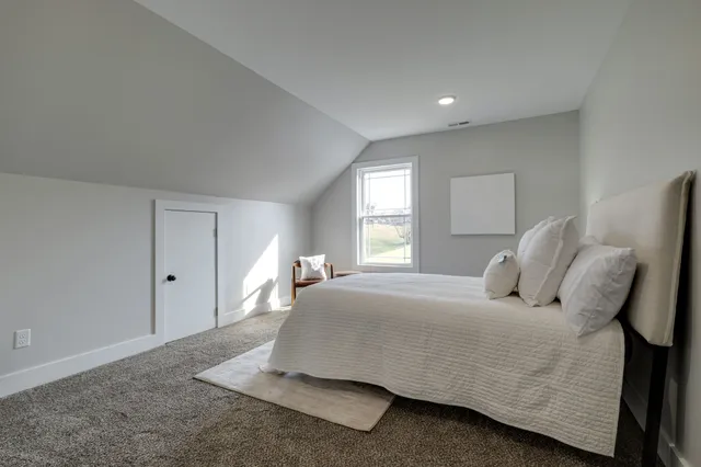 a bathroom with a sink a mirror and a window