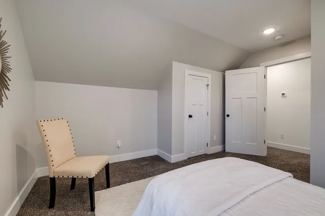 a front view of a brick house with a large windows