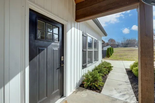 a aerial view of a house with table and chairs in the patio