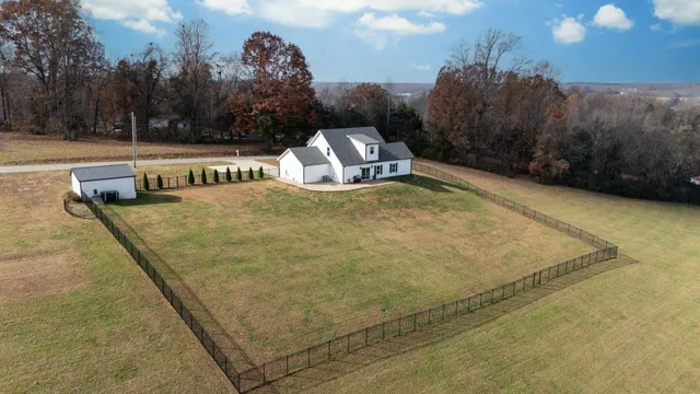 a view of a swimming pool with a yard and mountain view