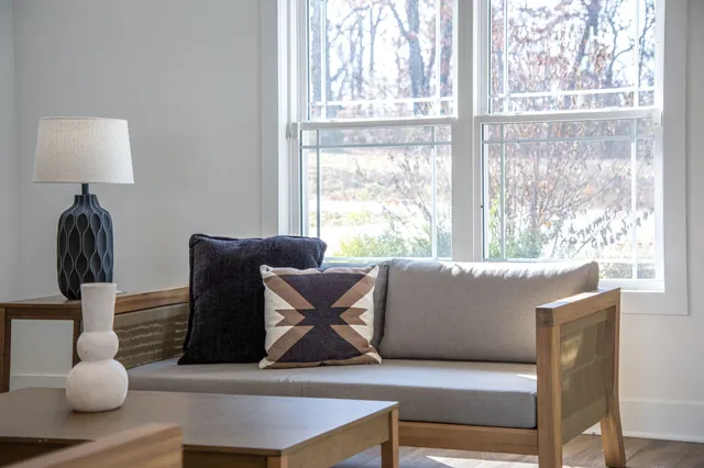 a kitchen with stainless steel appliances a center island refrigerator and cabinets