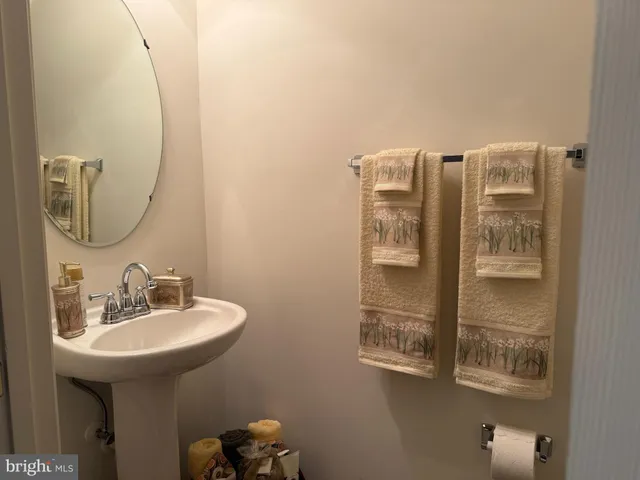 a bathroom with a sink and mirror