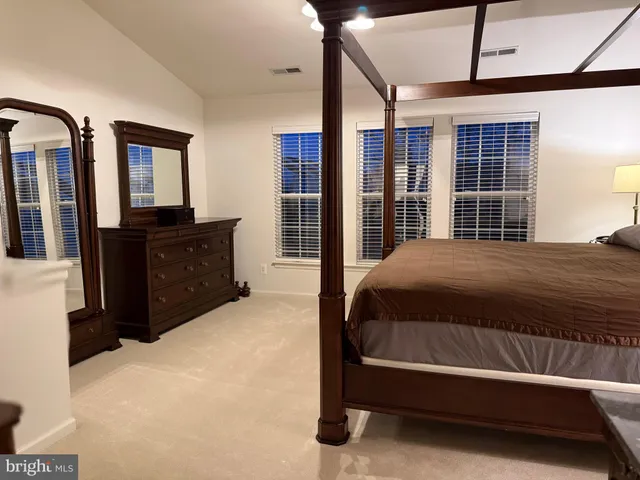 a view of a swimming pool with a lounge chairs