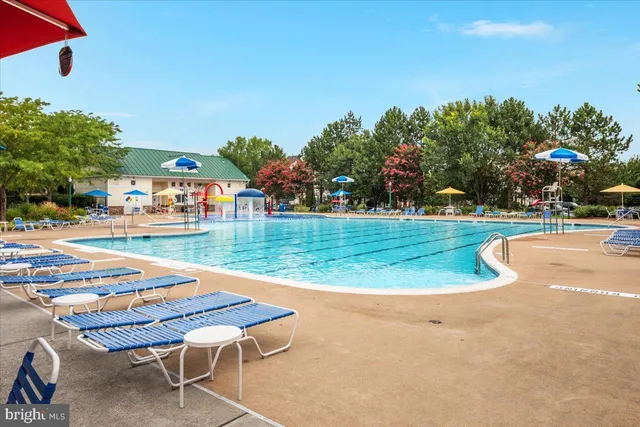 an aerial view of a house with a garden and houses