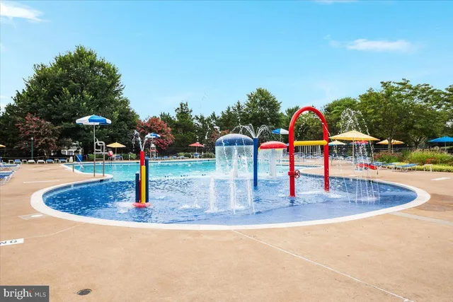 a view of houses with swimming pool