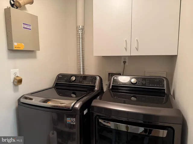 a stove top oven sitting inside of a kitchen