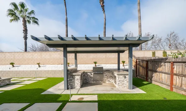 a view of a swimming pool with a yard