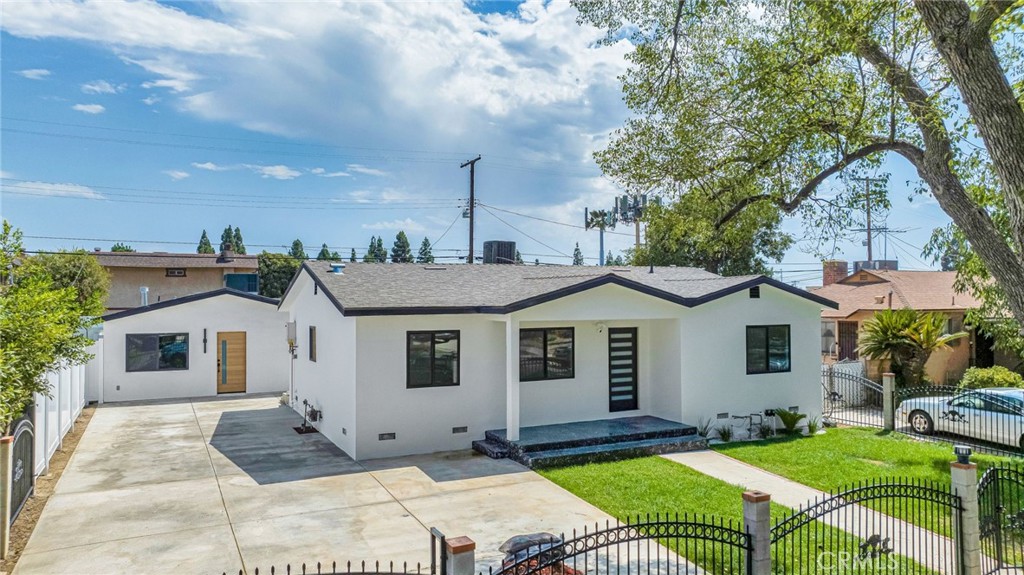 14448 Pinney Street Arleta, CA 91331 - Photo 1 of 1 a view of a house with a yard and sitting area