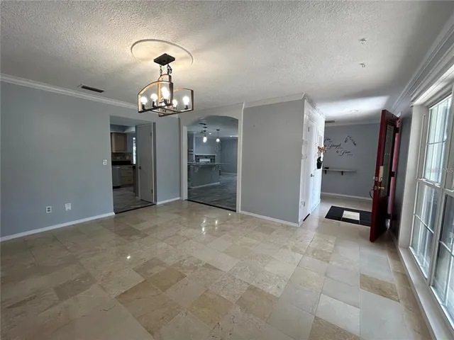 wooden floor in an empty room with a bathroom