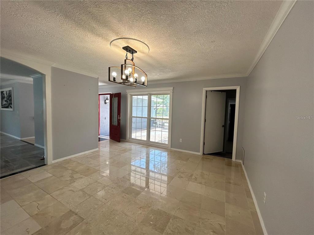 321 Ridgewood Street Altamonte Springs, FL 32701 - Photo 14 of 50 wooden floor in an empty room with a window