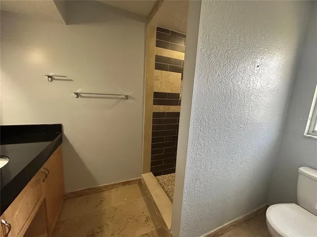a bathroom with a sink and toilet