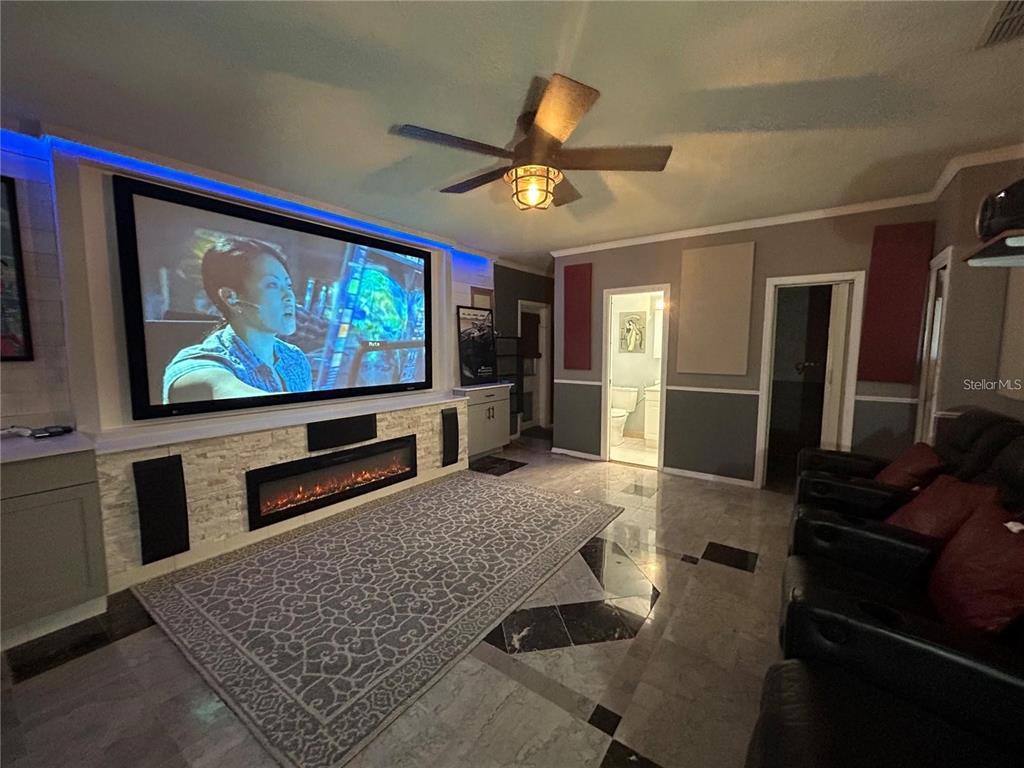 321 Ridgewood Street Altamonte Springs, FL 32701 - Photo 28 of 50 a living room with furniture and a flat screen tv