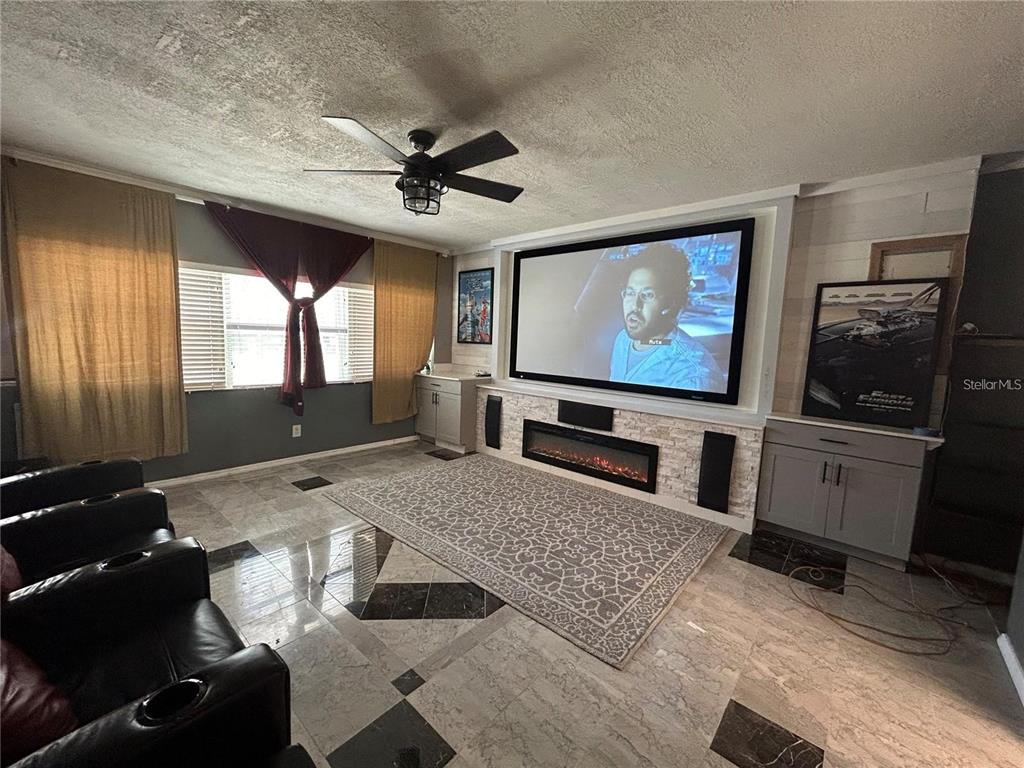 321 Ridgewood Street Altamonte Springs, FL 32701 - Photo 29 of 50 a living room with furniture and a flat screen tv
