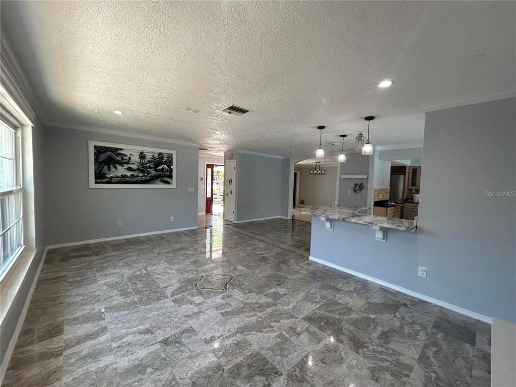 321 Ridgewood Street Altamonte Springs, FL 32701 - Photo 4 of 50 a view of a hall and kitchen with a large window