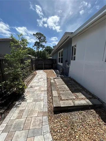 a view of a backyard of the house