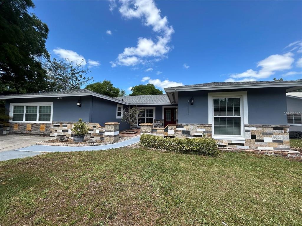 321 Ridgewood Street Altamonte Springs, FL 32701 - Photo 50 of 50 a front view of house with yard outdoor seating and barbeque oven