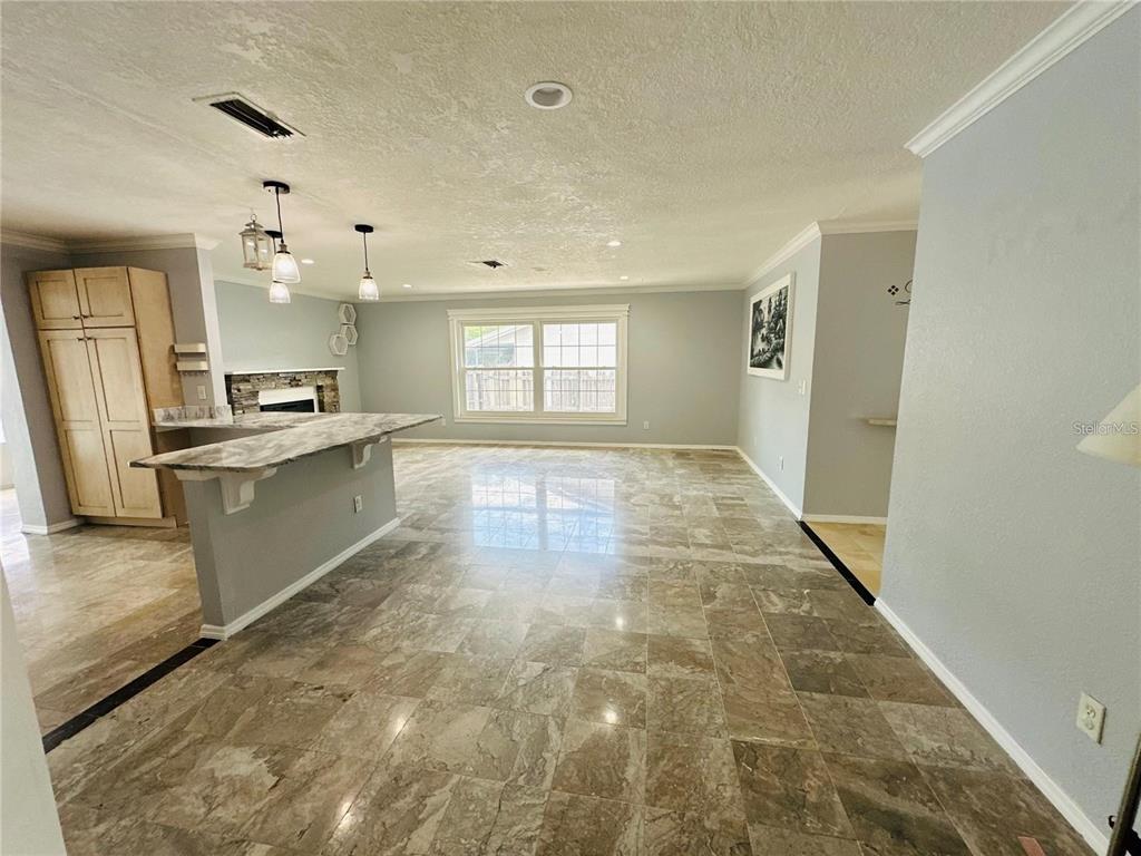 321 Ridgewood Street Altamonte Springs, FL 32701 - Photo 8 of 50 a kitchen with stainless steel appliances granite countertop a sink stove and refrigerator