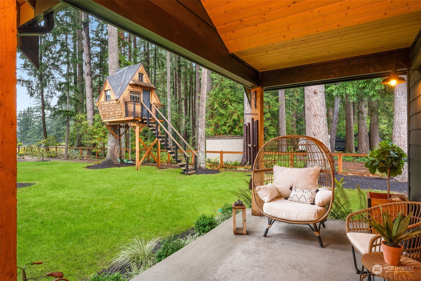 21468 Calhoun Road Monroe, WA 98272 - Photo 27 of 36 a view of a house with backyard sitting area and garden