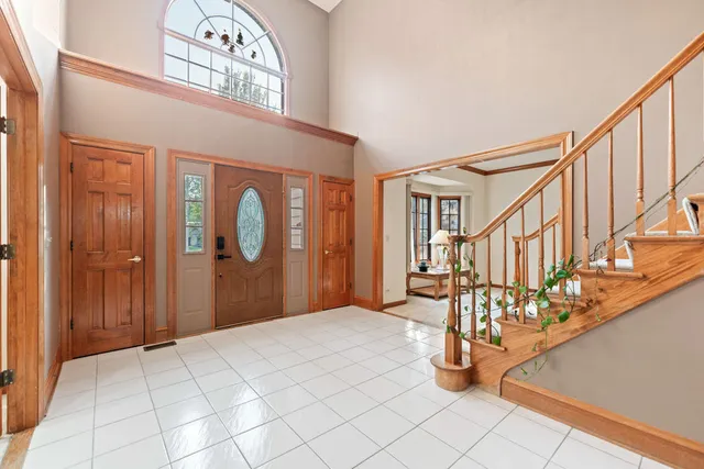 a kitchen with stainless steel appliances kitchen island granite countertop a stove a sink and a refrigerator