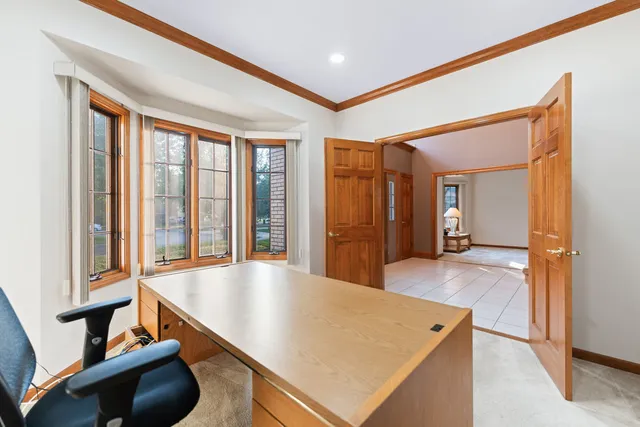 a large kitchen with stainless steel appliances kitchen island granite countertop a stove a sink dishwasher and a refrigerator