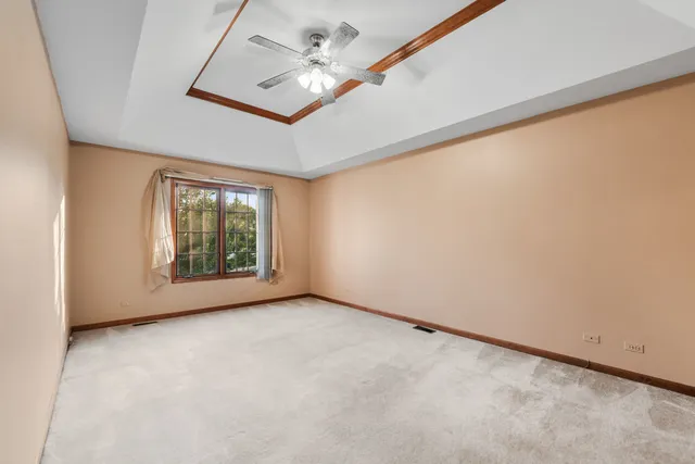 an empty room with a empty space and windows