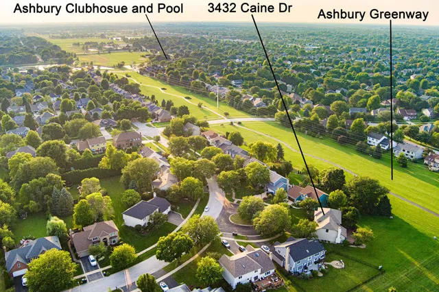 an aerial view of a house with outdoor space