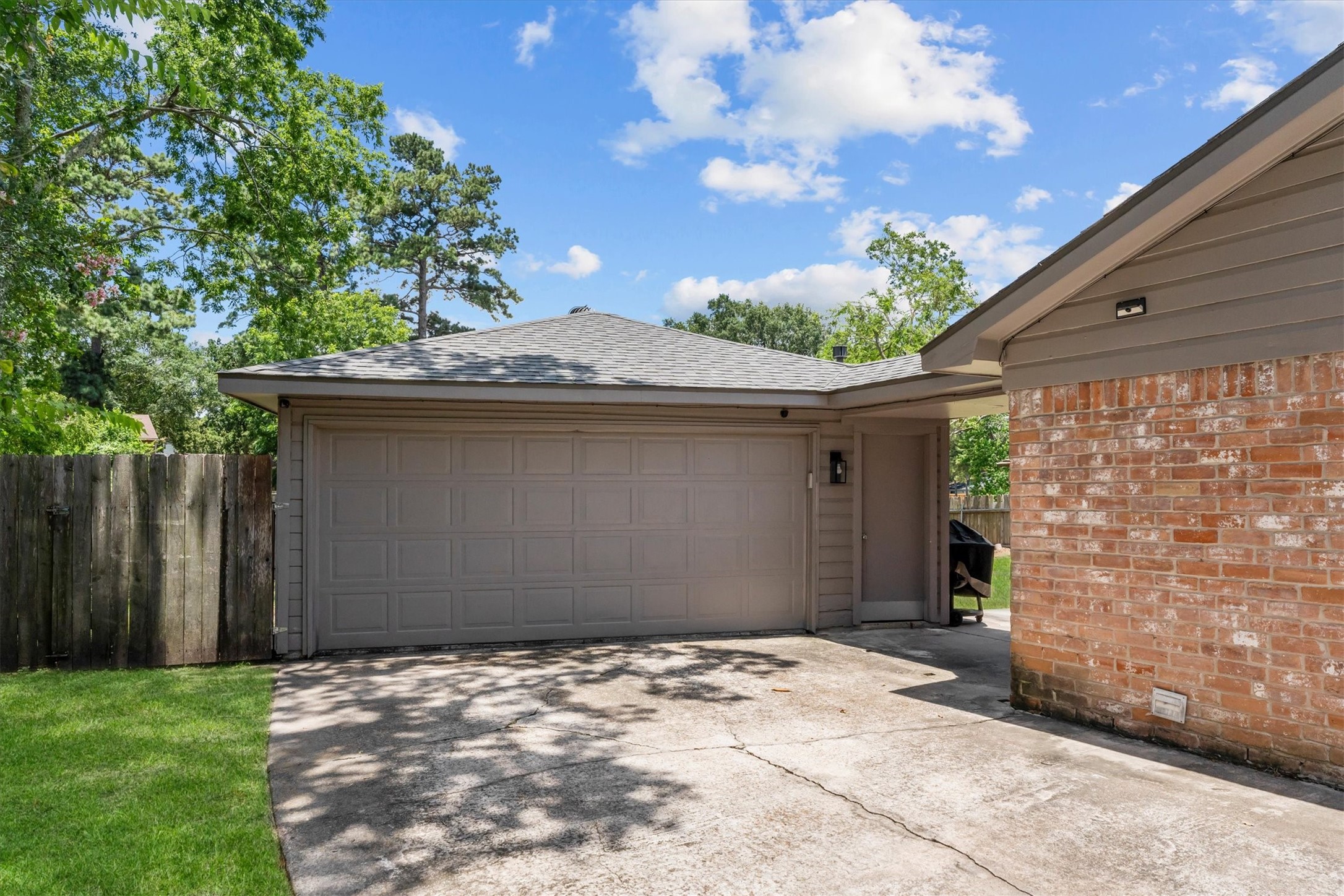4026 Oxhill Road Spring, TX 77388 - Photo 37 of 40 The detached two-car garage offers convenient rear access to the home along with additional space for storage, hobbies, or everyday functionality.